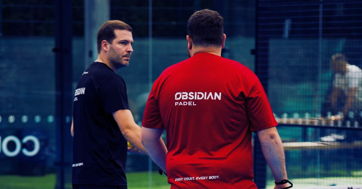 Two padel players on court in Obsidian Padel kit