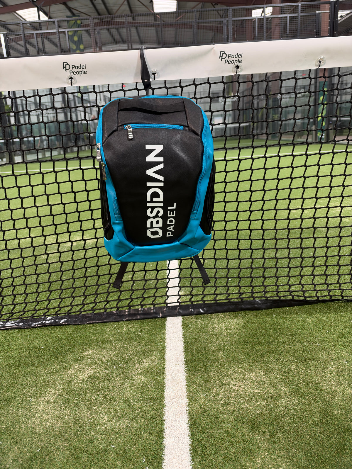 Obsidian Padel Backpack in black and blue alongside the black Obsidian Tournament Padel Bag